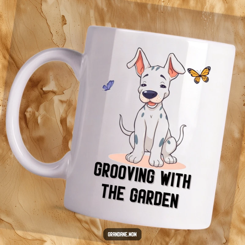 Funny Grand Dane mug, showing a dog doing a playful wiggle, attempting to dance joyfully with a delicate butterfly.