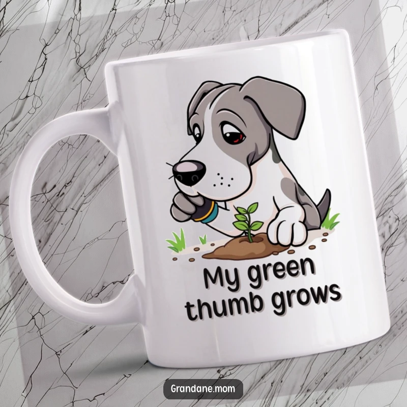 Funny Great Dane gardener mug showing a gentle giant dog in gloves, carefully planting a tiny seedling in soil.