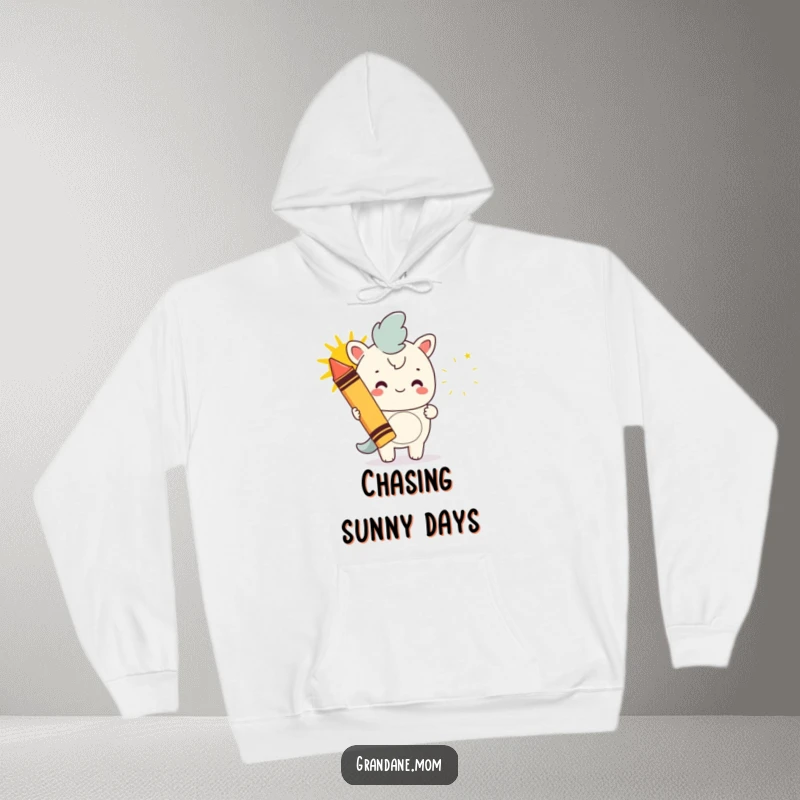 Funny daniff hoodie, a dog with a giant crayon drawing a happy sun, symbolizing artistic talent and cheer, a warm funny gift.