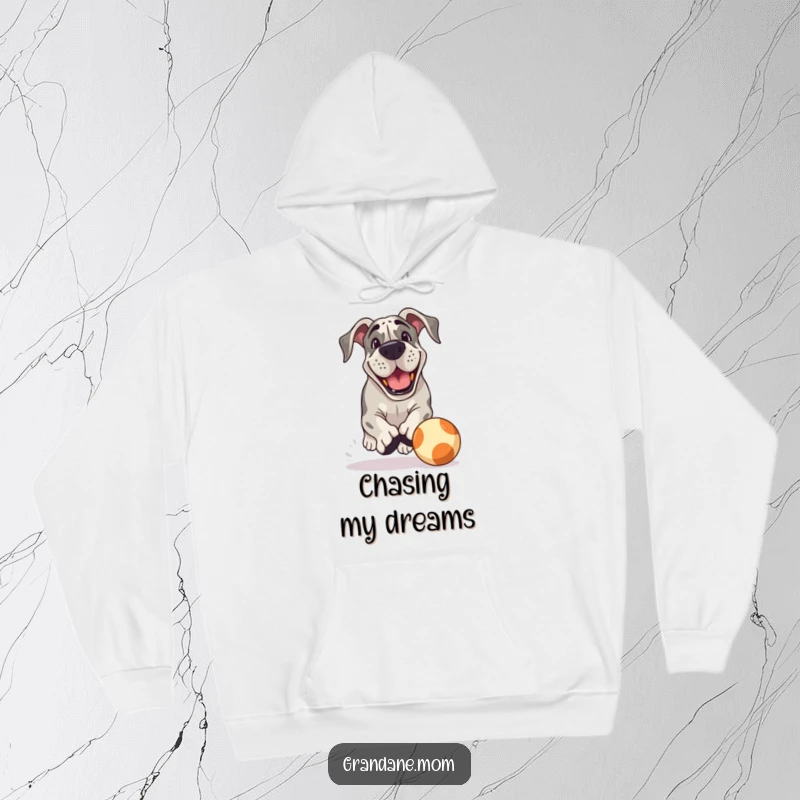 Funny Grand Dane Hoodie: A playful Grand Dane with a grin chases a bouncing ball, offering warmth and humorous, energetic vibes.