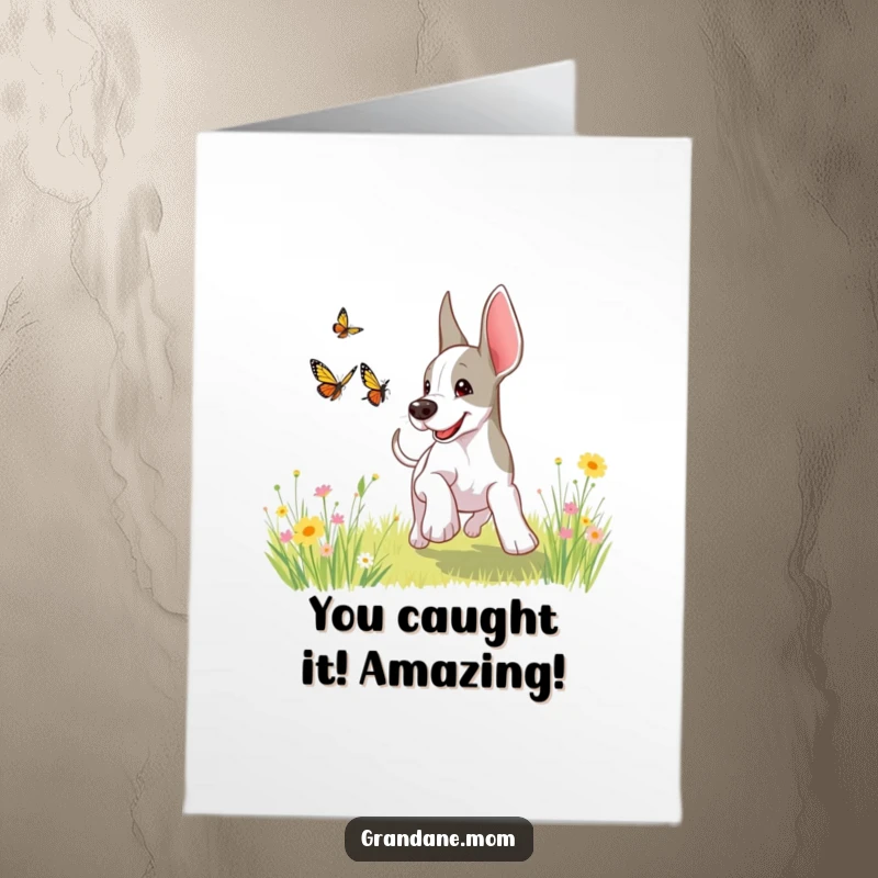 Funny Free Printable Congratulations Card: A happy Grand Dane playfully leaps after a butterfly in a sunny meadow, embodying pure excitement.
