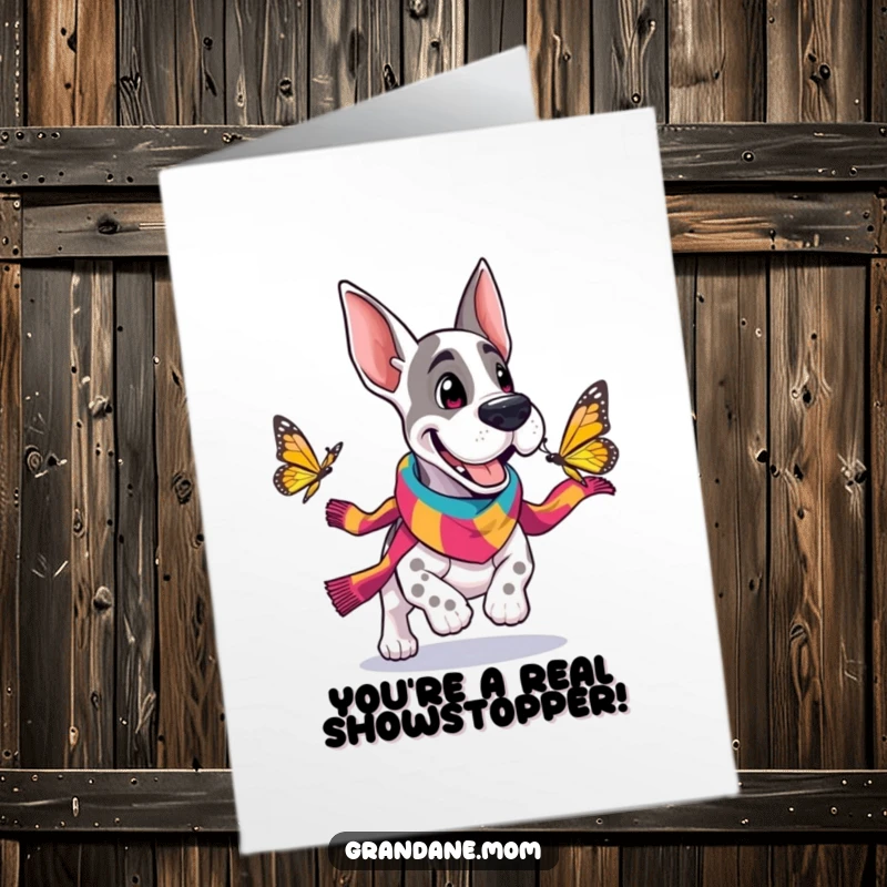 Funny Free Printable Congratulations Card: Grand Dane in scarf gleefully chasing a butterfly, celebrating achievements.