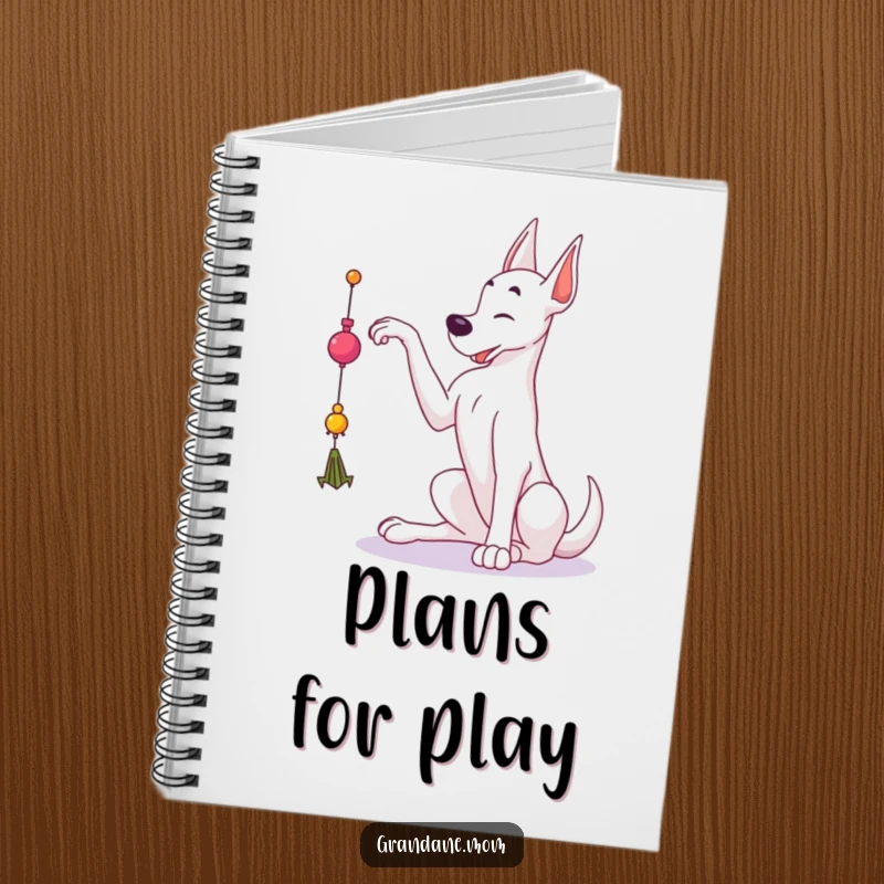 Funny Grand Dane notebook with a large dog reaching for a dangling toy, perfect for jotting notes and playful thoughts.