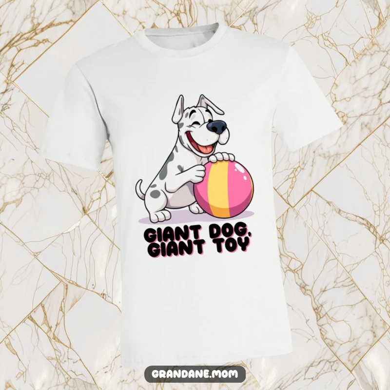 Funny Grand Dane t-shirt, joyfully about to nudge a massive, colorful ball, capturing a moment of pure canine bliss.