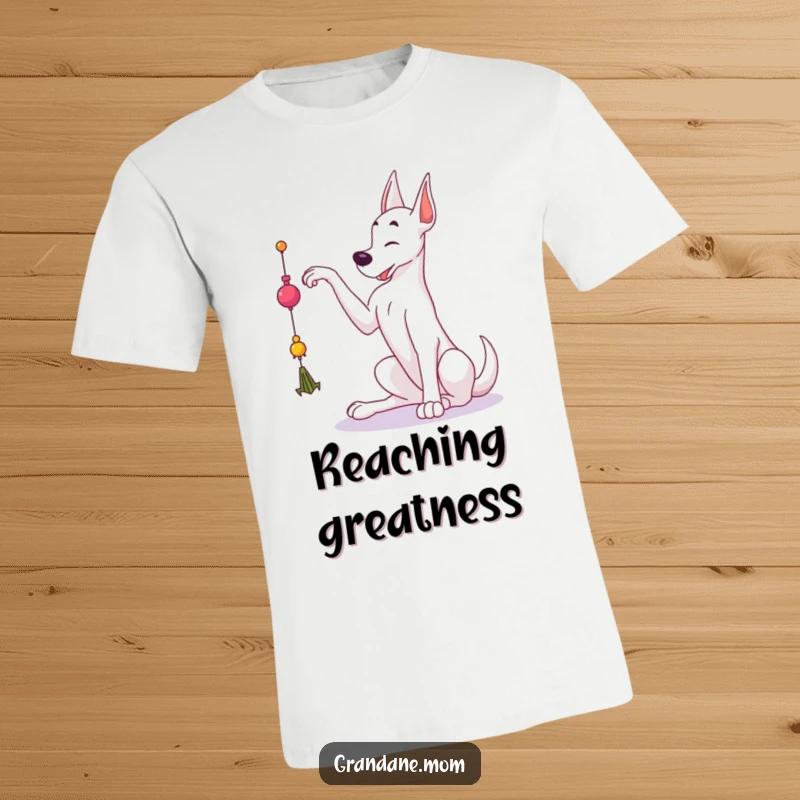 Funny Grand Dane t-shirt with a large dog stretching elegantly to grab at a dangling toy, capturing playful athleticism.