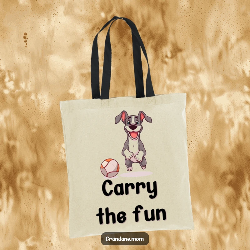Funny Tote Bag shows a happy Great Dane playing fetch with a comically large ball, ready for any adventure.